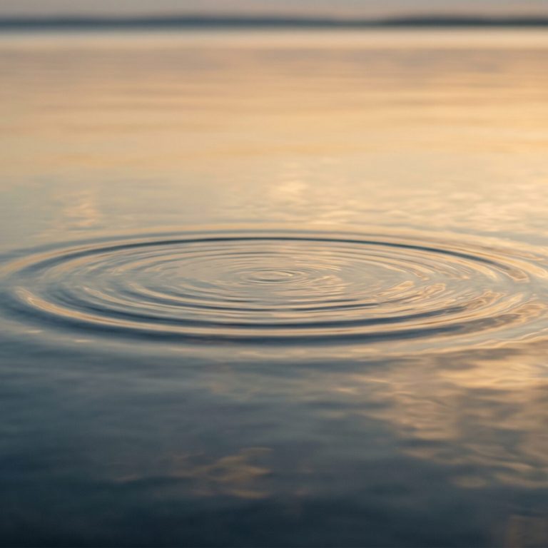 Calm water surface with a single gentle ripple — imagery for relaxation and stress relief